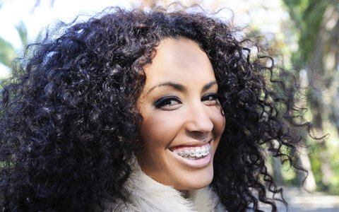 A smiling woman with braces in Boulder Colorado