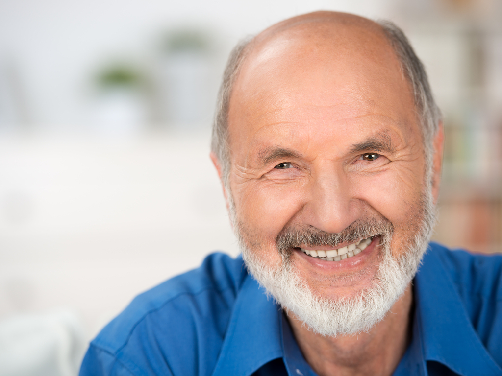 Smiling older man with dentures in Boulder from Boulder County dentures specialist