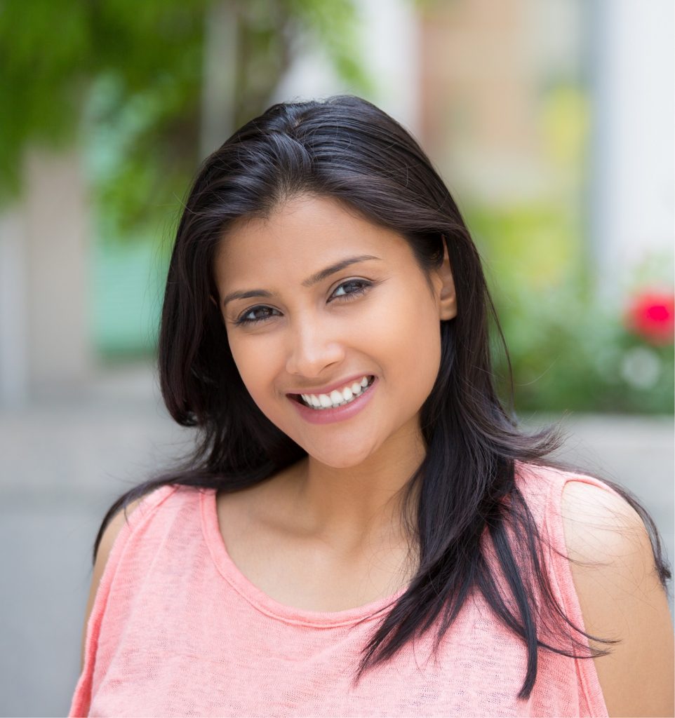 Smiling young female with prepless veneers for teeth in Boulder