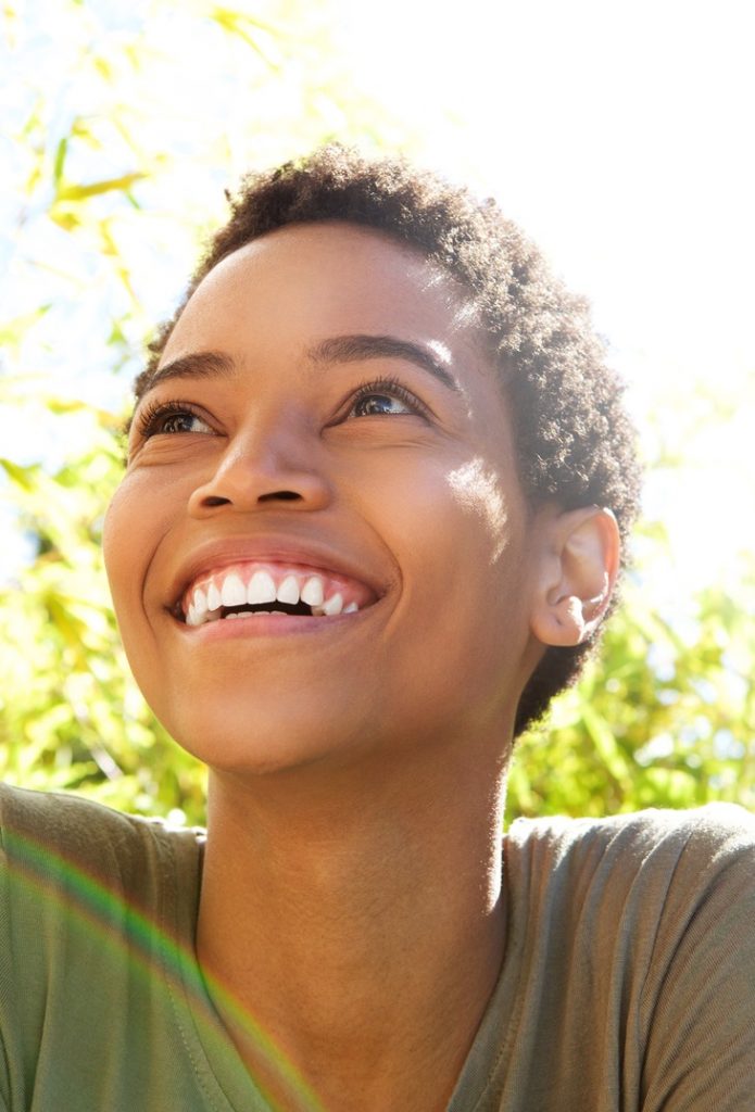 Smiling woman with dental veneers from Boulder County Smiles