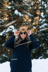 Smiling girl with white teeth on a snow hike in Boulder, Colorado